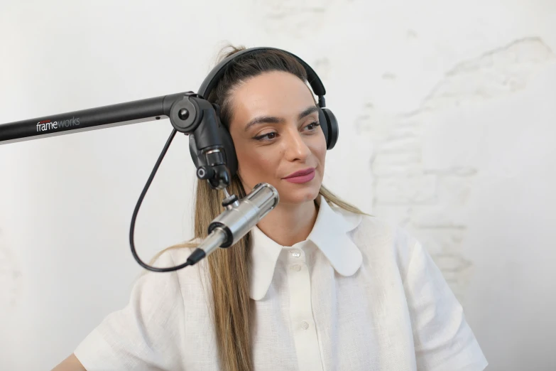 a woman is listening to music with a microphone