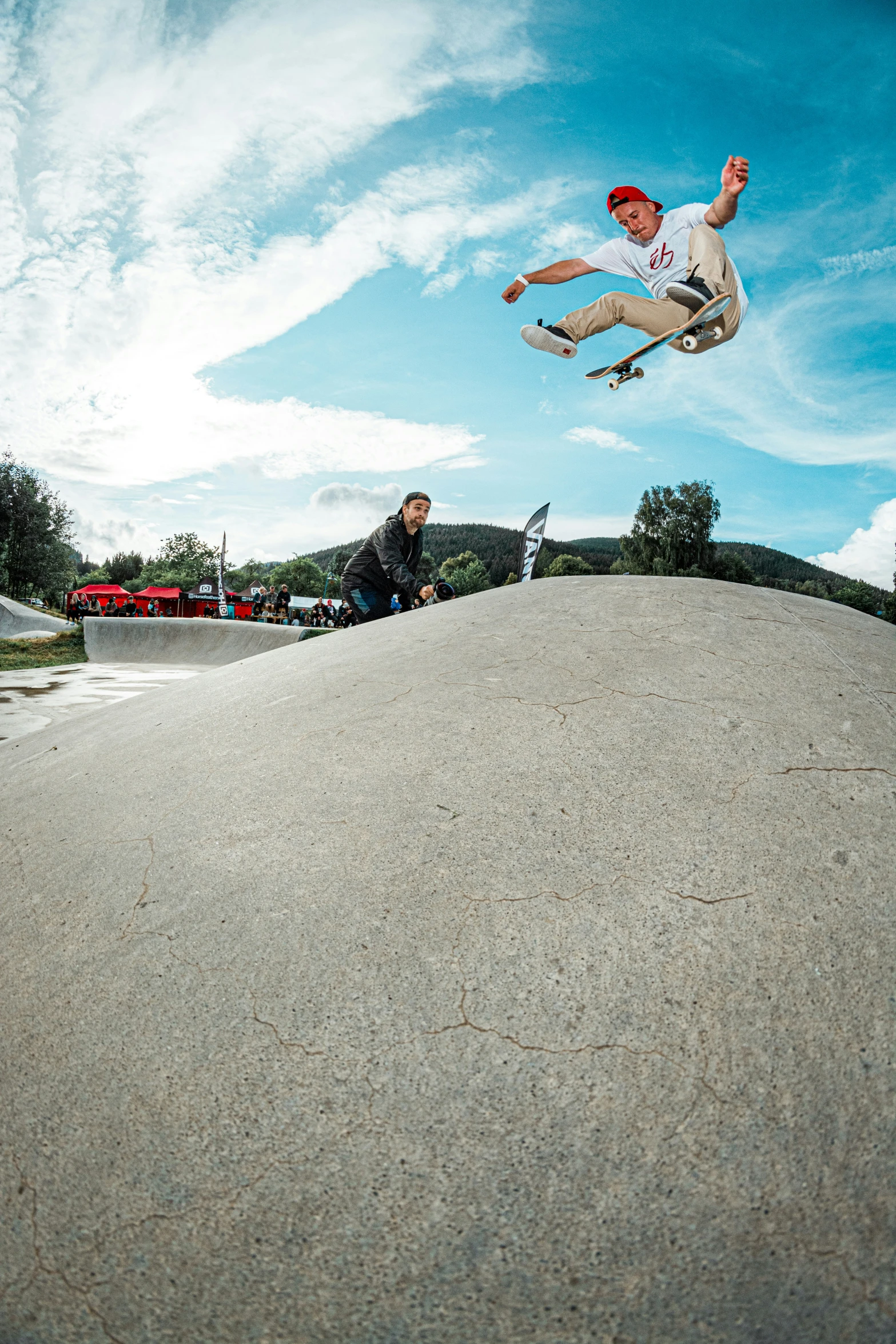 a skateboarder at a park is attempting a trick