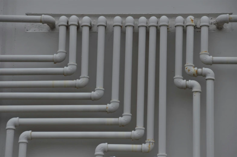 a set of pipes are lined up to give electrical use