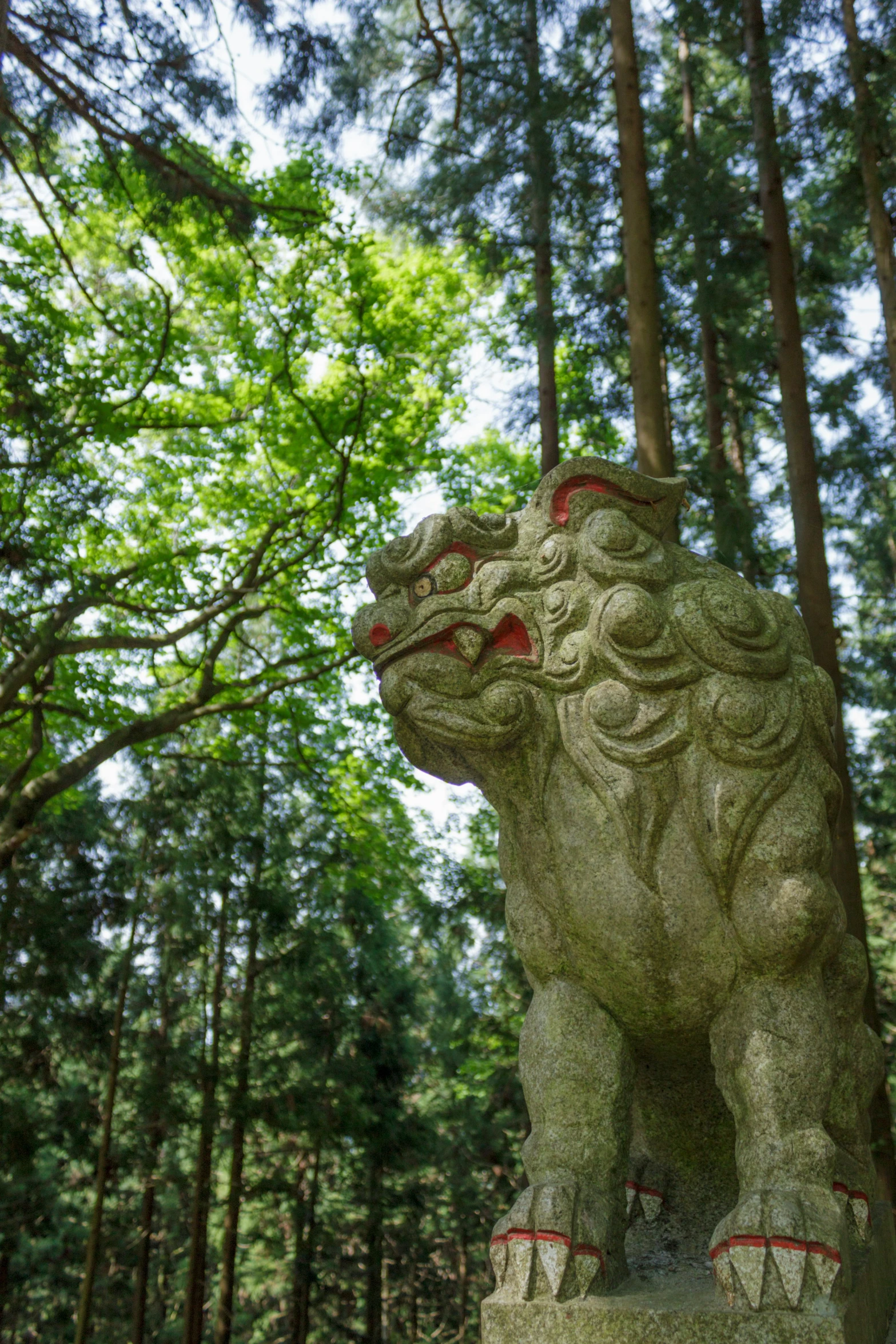 there is a statue of an animal in the woods