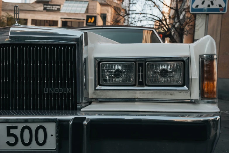 a white car parked next to a building