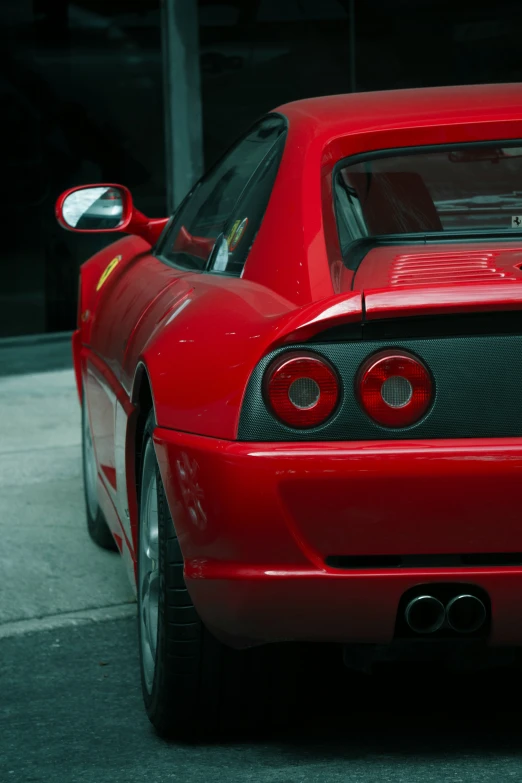 the rear end of a red sports car