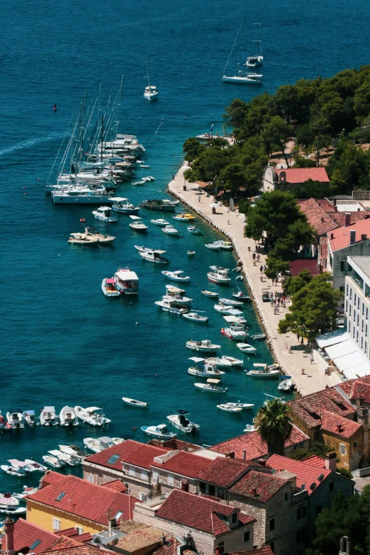 small boats sailing down a large body of water