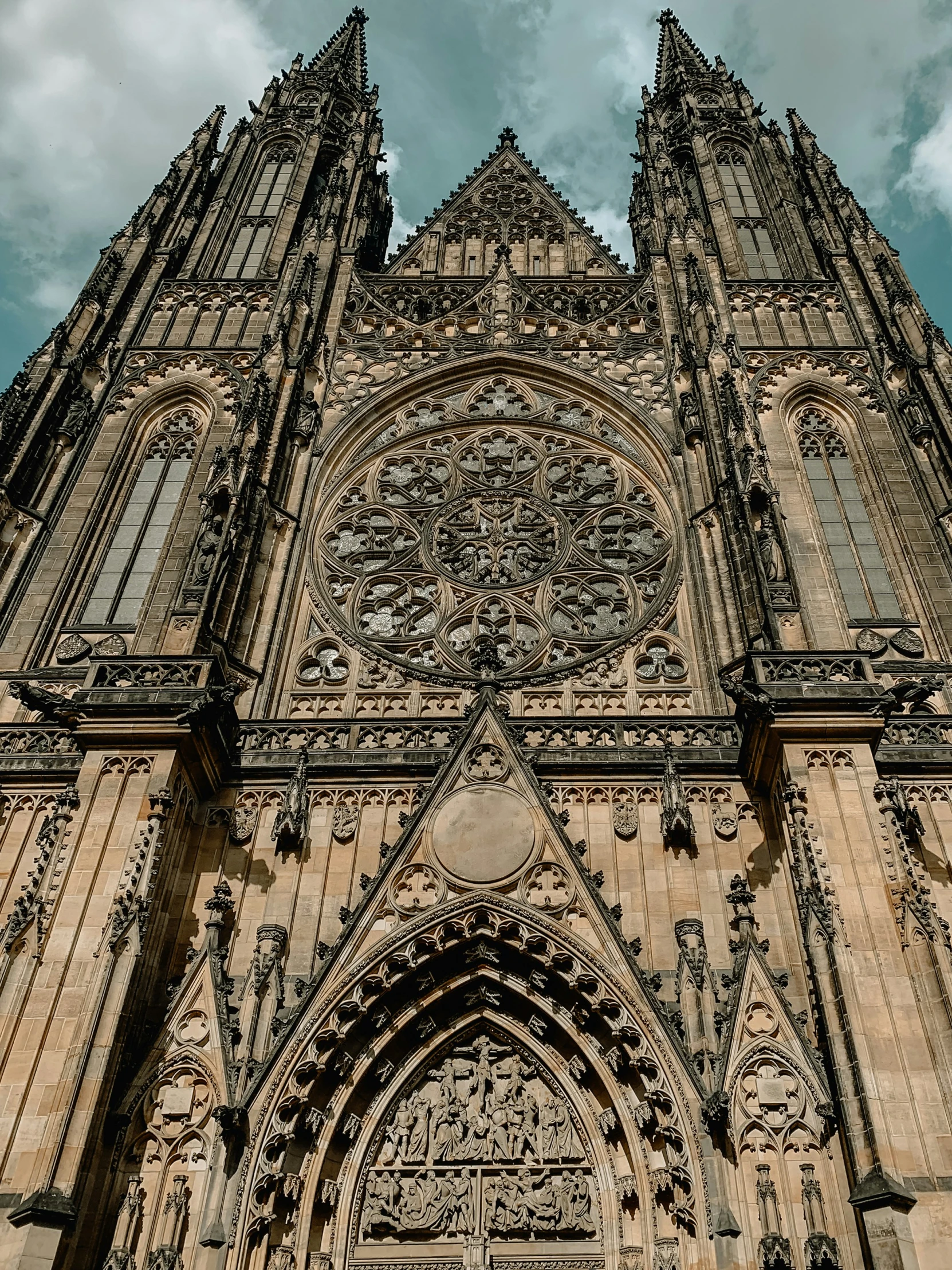 a tall cathedral building with many windows and a clock on it