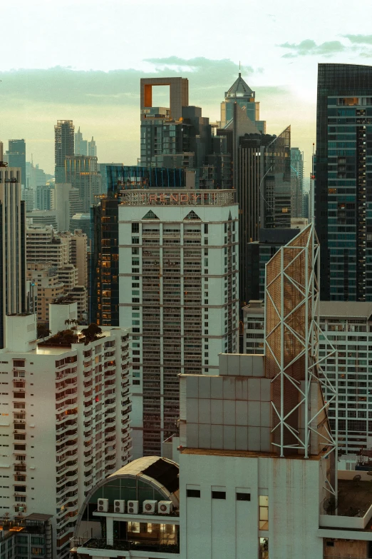 the city skyline with many skyscrs and buildings in front