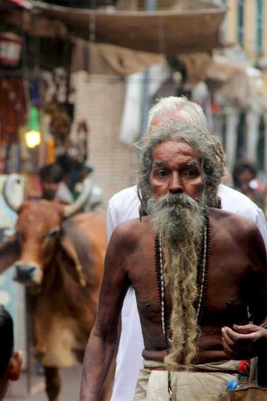 a man with a long white beard and big id