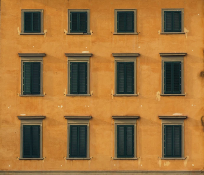 a building with eight small windows with black bars