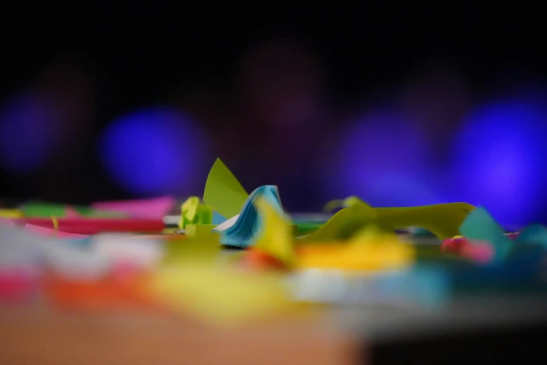 a brightly colored pile of paper toys on a table