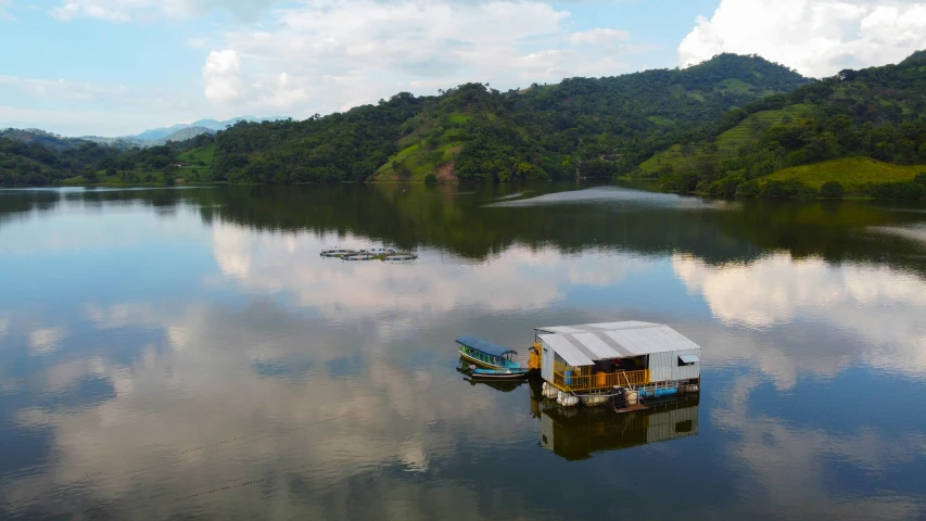 a group of small boats floating on top of a lake