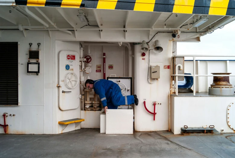 a person is fixing the valve on a ferry