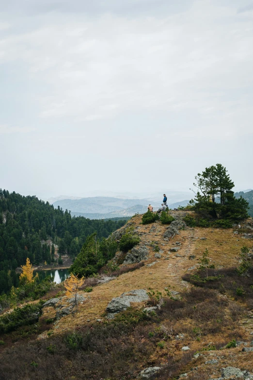 a person that is sitting on a hill