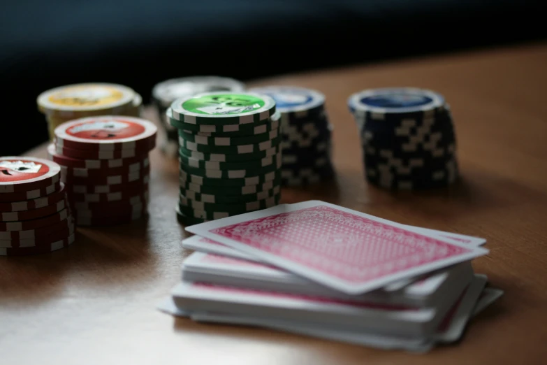 a table topped with poker cards and dice