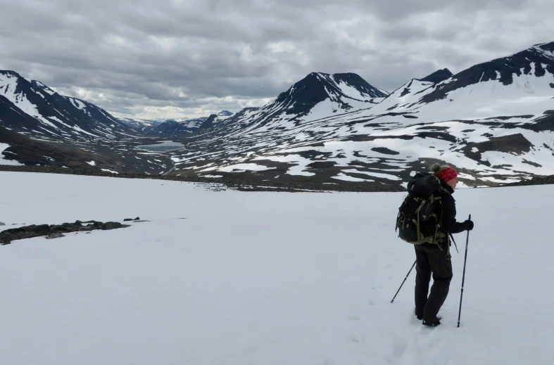 a person is hiking up a snowy mountain