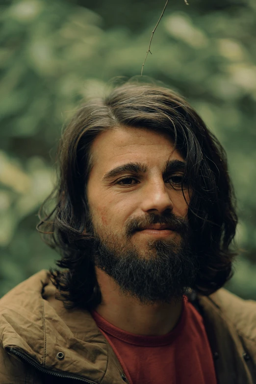 a man with long hair and a beard