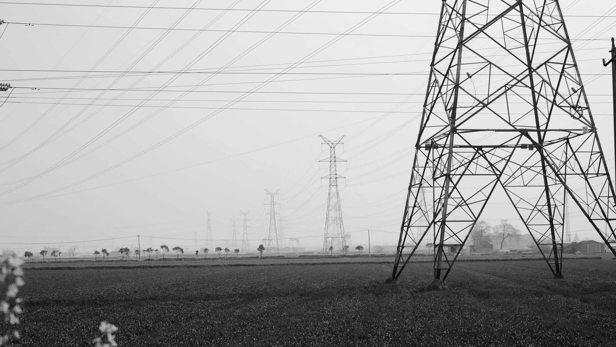 an industrial area with power lines in the background