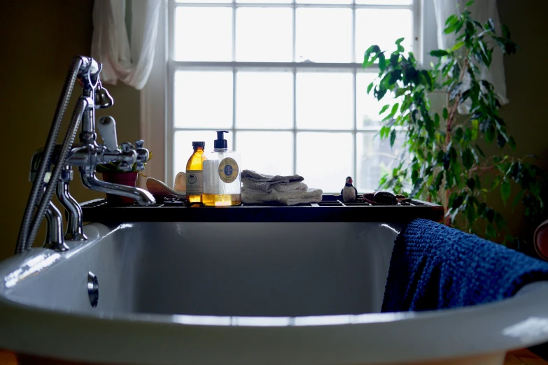 there are two pairs of socks laying on a tub in the bathroom