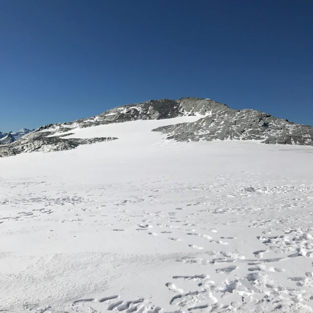 the slopes have some tracks of footprints in the snow