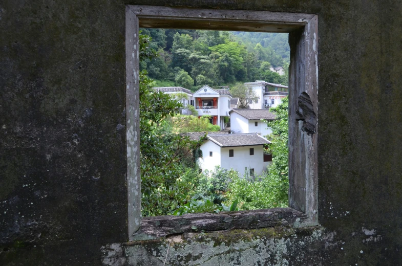 an empty window sits outside an old building