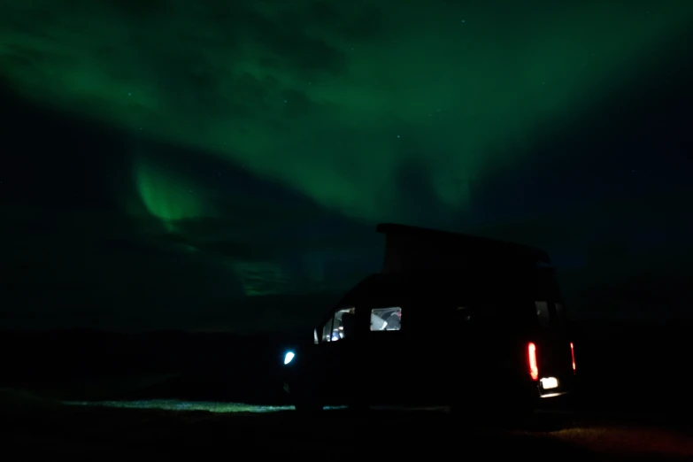 an ice bus driving on the road at night