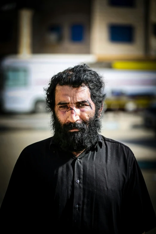 a man with a long beard and a black shirt