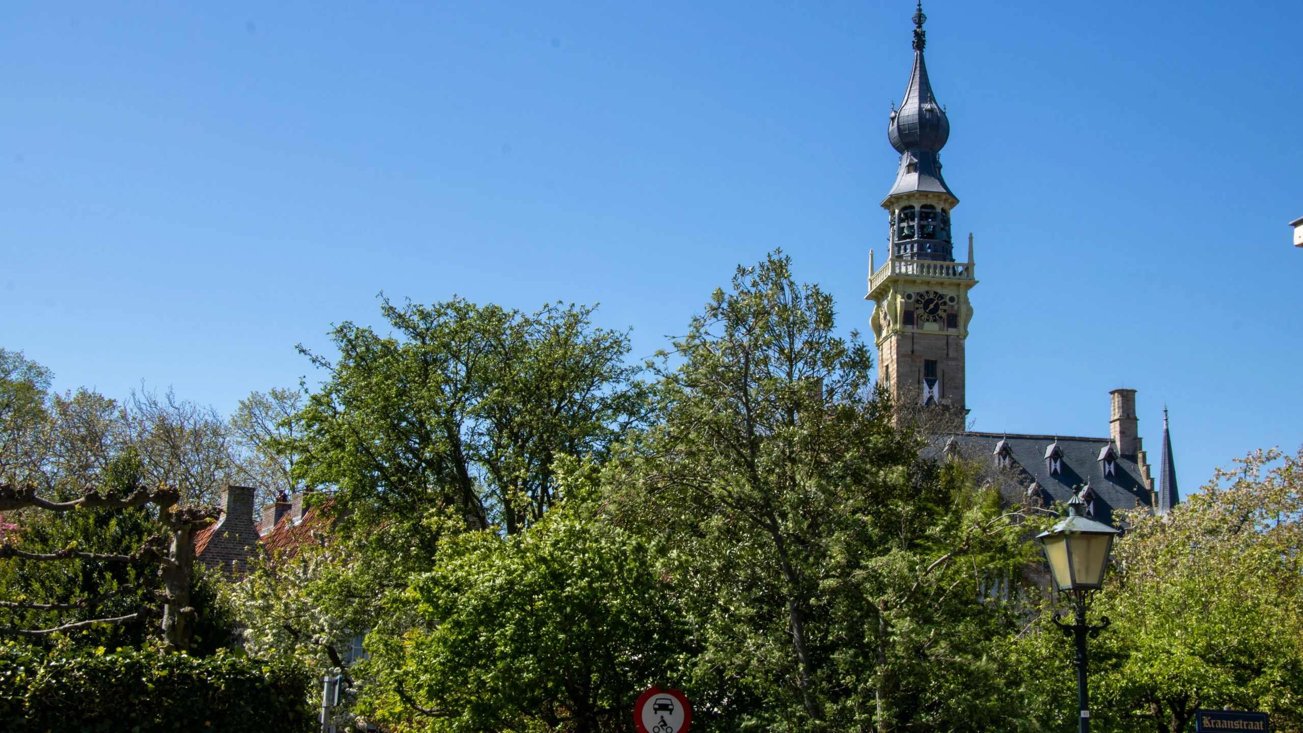 a tall clock tower towering over a city skyline