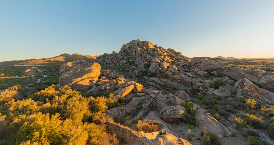 an aerial s of a rocky hill and trees