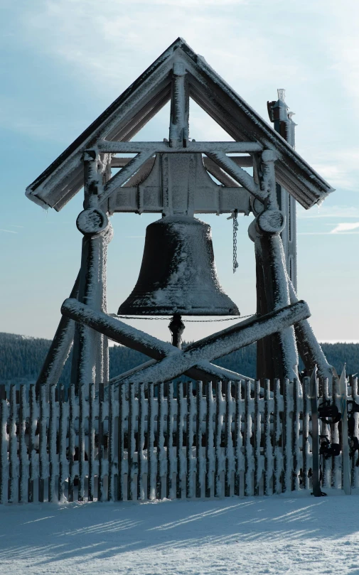 a white house is adorned with a bell