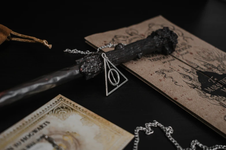 the harry potter wand is resting on a piece of parchment paper