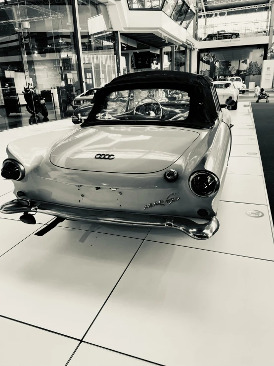 a vintage car on display at an antique store