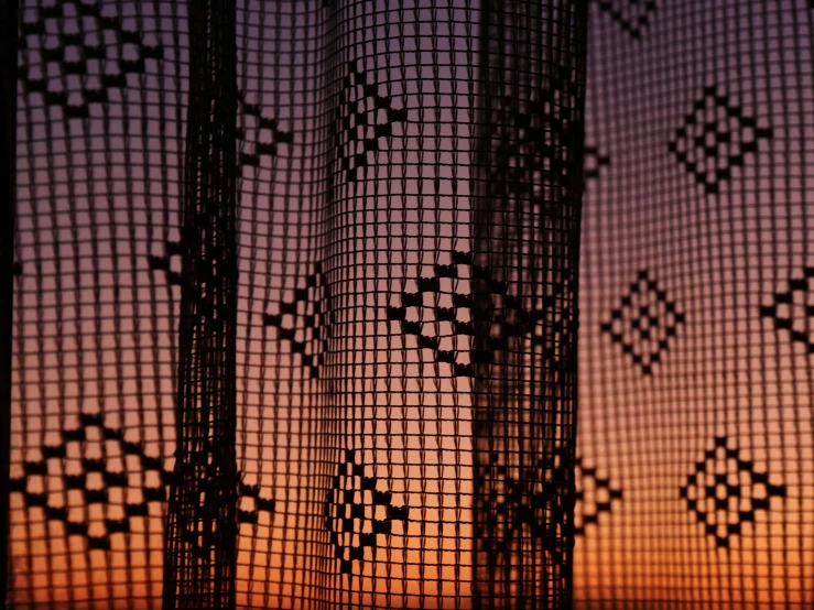 an image of a screen looking out at a sunset