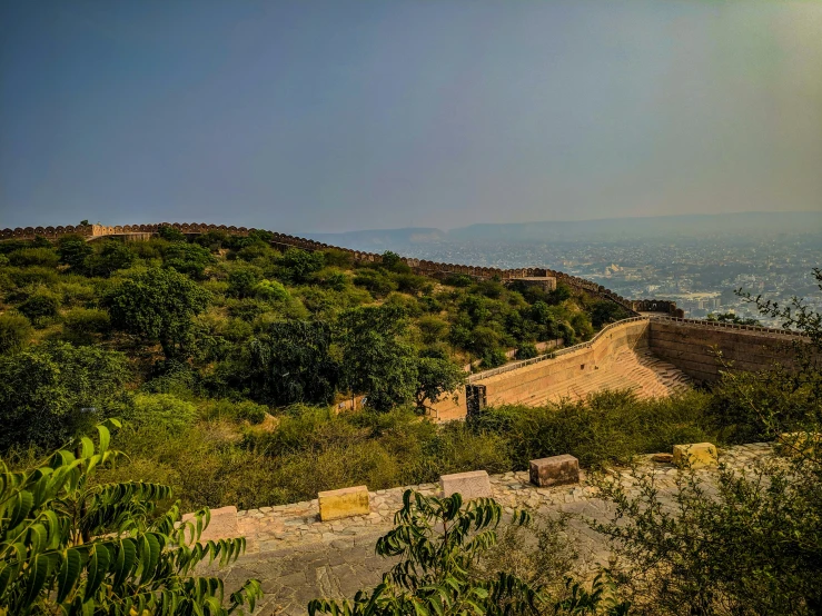 an image of a dirt hill that is overlooking a valley