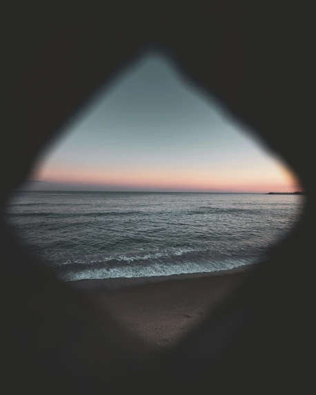 a view of an ocean in a mirror