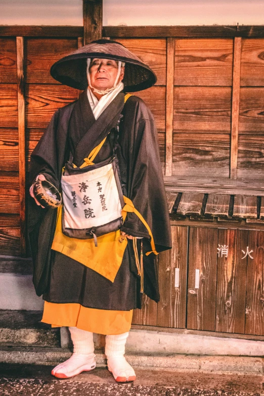 a person wearing a costume and hat with writing on it