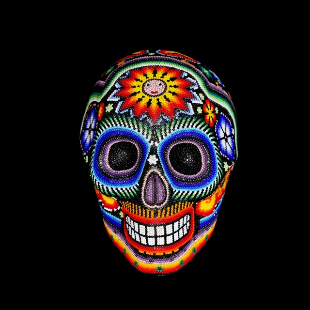 an image of an artistic skull painted with colorful paints