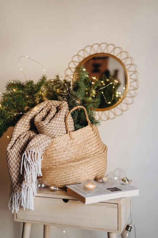 a wicker purse and christmas decorations near a mirror