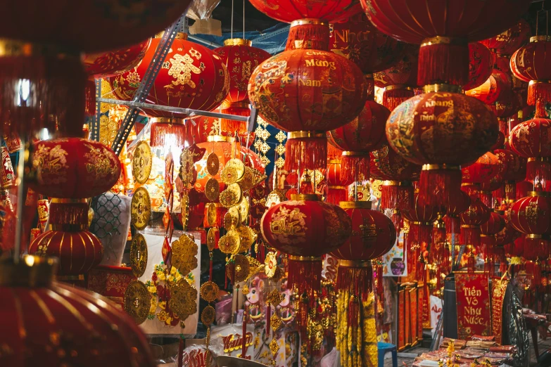 there is a shop with lots of oriental lanterns hanging