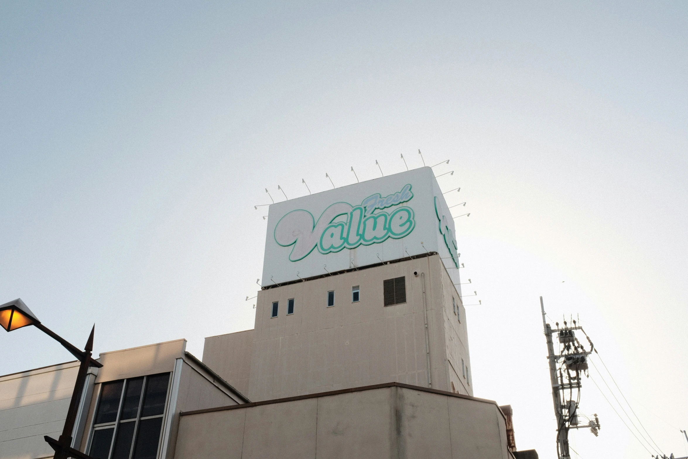 the large sign is advertising a restaurant in front of the building