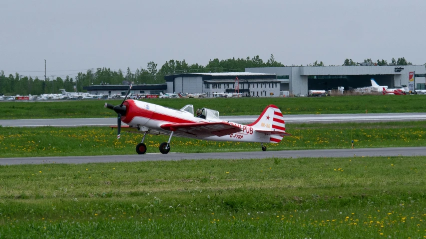 a small aircraft sitting on top of an airport runway
