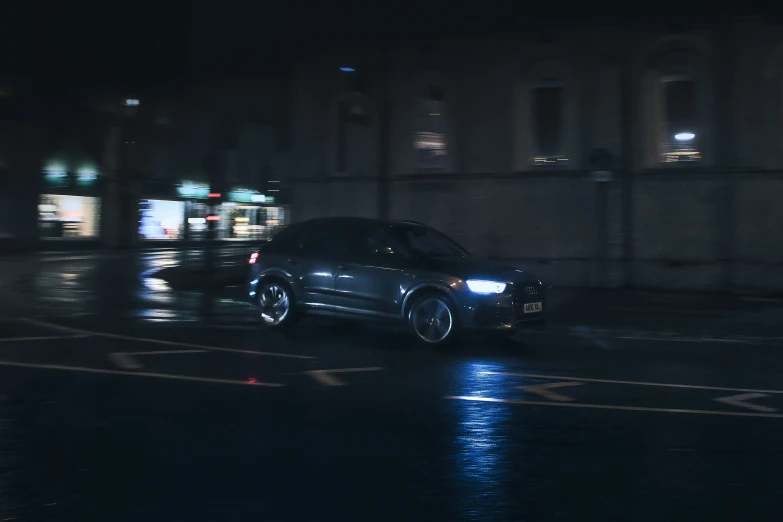 a vehicle driving down the road at night