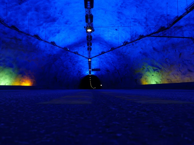 an underground tunnel with brightly lit lights