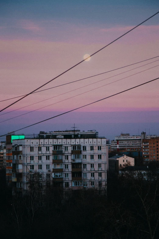 the city is seen with power lines across from the buildings