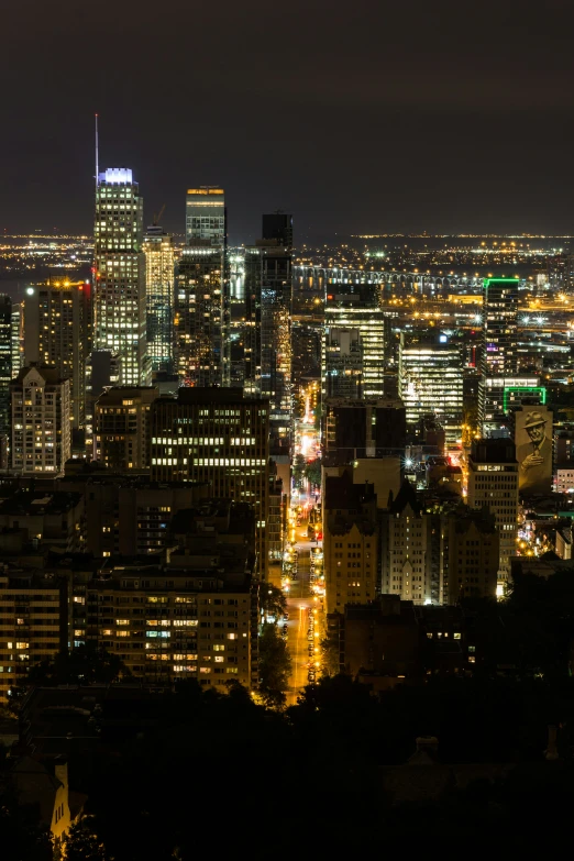 city skyline at night with light traffic on it