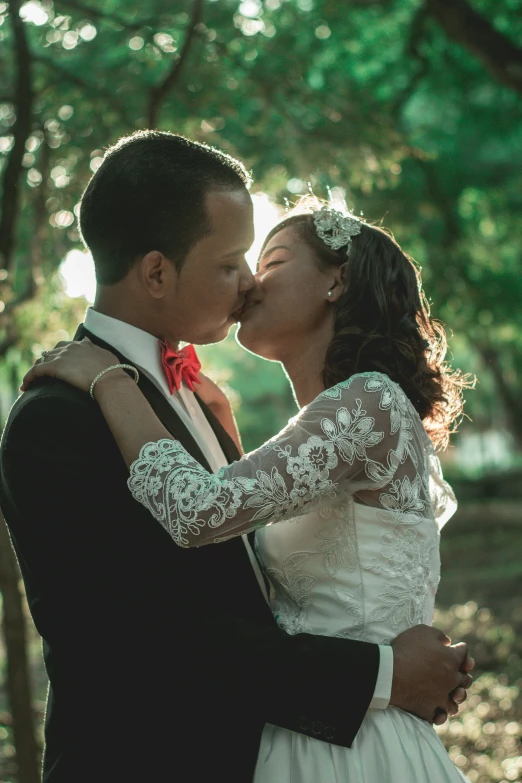 the bride and groom share a tender moment during their wedding day