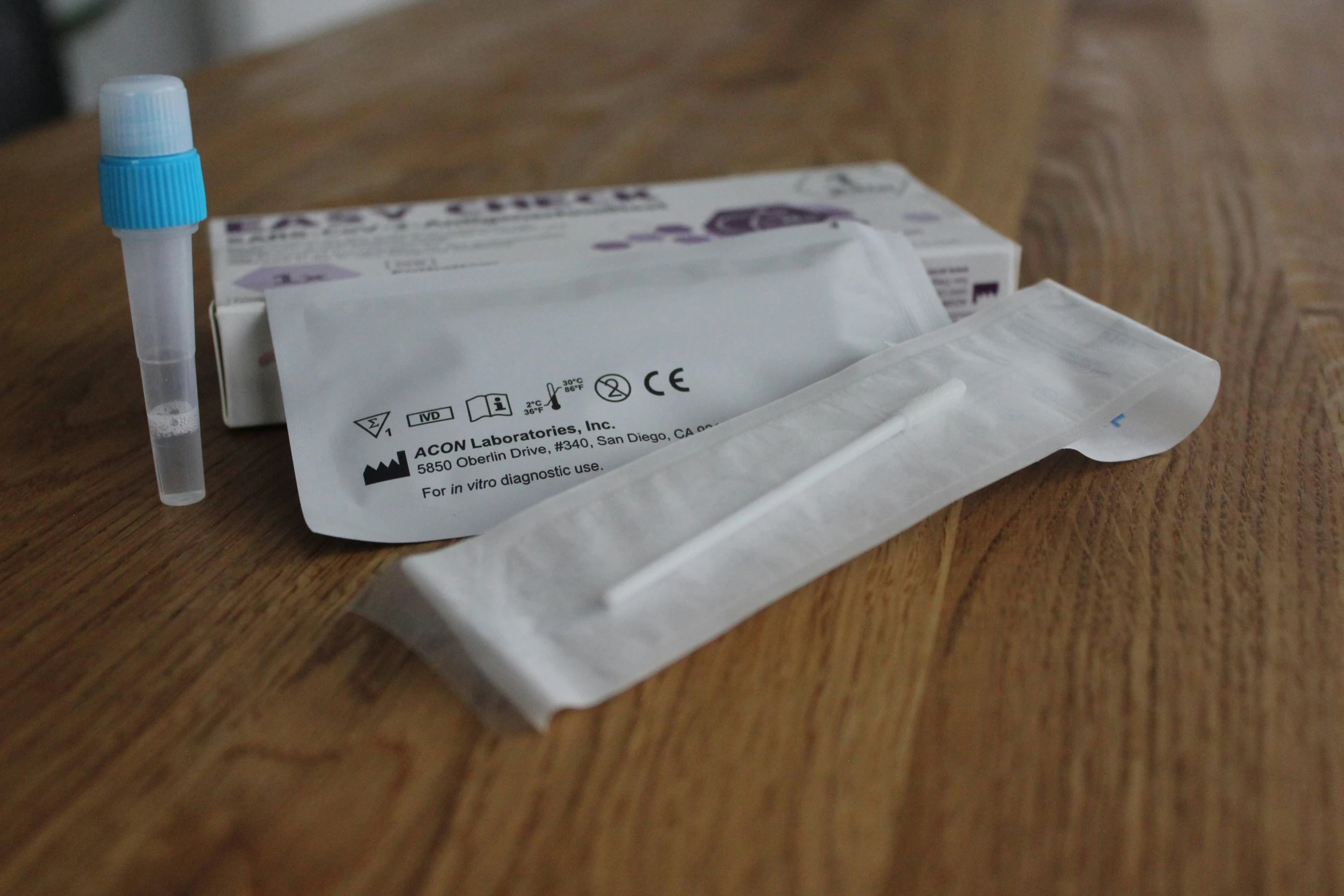 a condom condom sitting on top of a table next to a packet