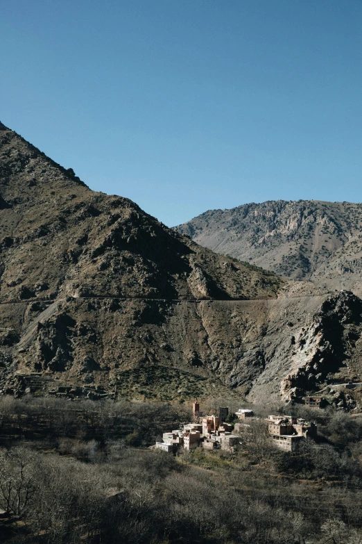 an old house in the middle of the desert