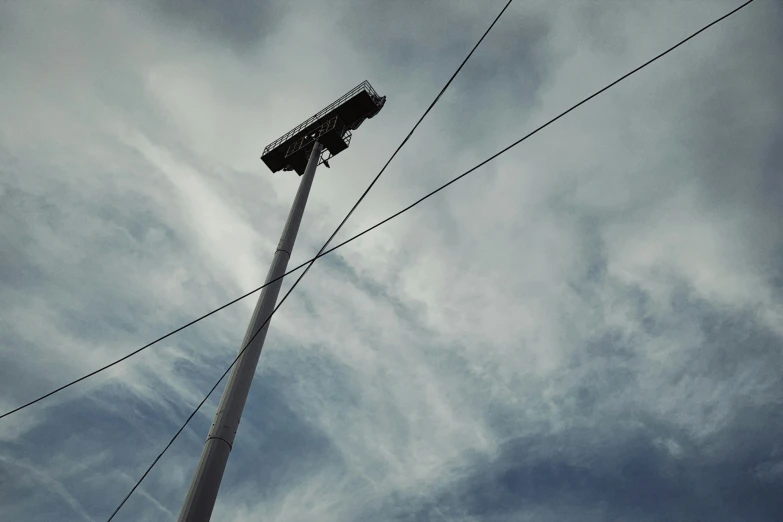 an electric pole that has been bent to allow traffic