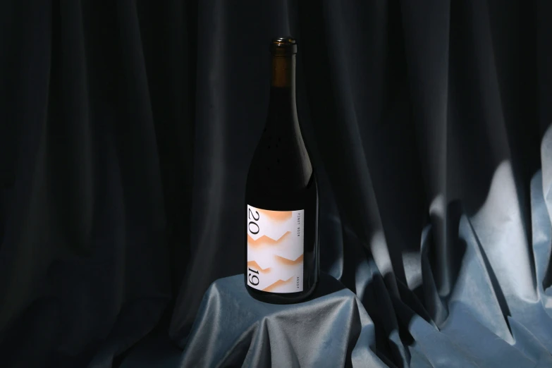 a wine bottle that is sitting on top of a table