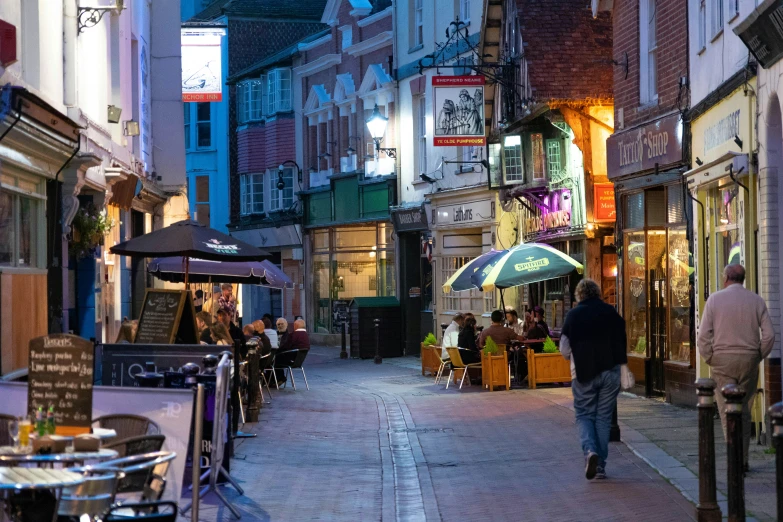 a narrow street with lots of tall buildings on it