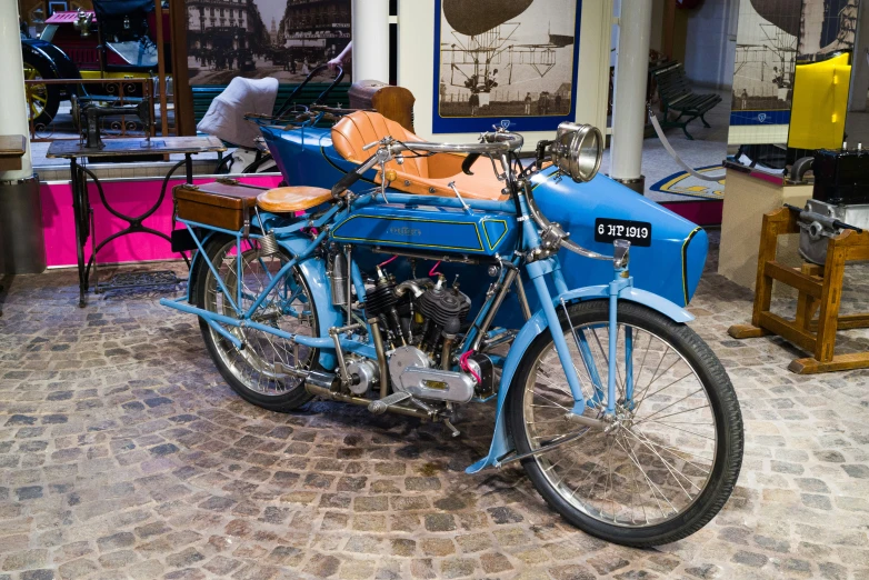 a vintage motor bike is parked in a shop