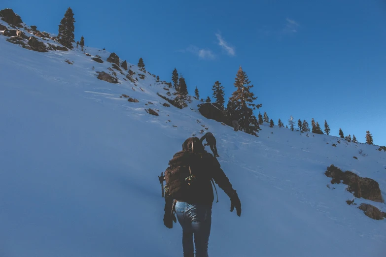 a man is going uphill on his snow board